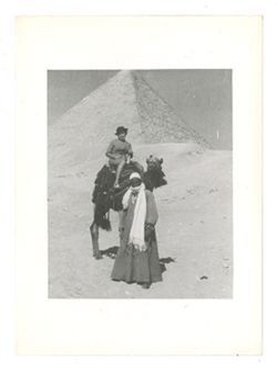 Woman on a camel in front of the Great Pyramid of Giza