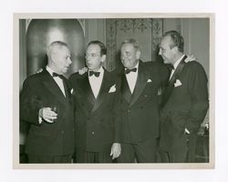 Group of men talking and drinking