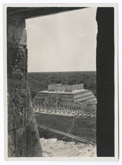 Item 0158. Similar to Item 157 above, same view of Temple of the Warriors from the Castillo, but more of the doorway of the Castillo temple is visible. Stone carvings can be seen in wall to the left.