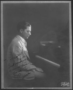 Portrait of a man seated at the piano.