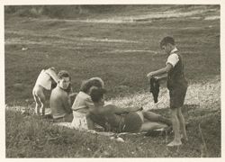 Woman, soldiers and children sunbathing near Regensberg, Germany
