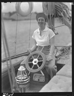 Mrs. Matter at wheel of yacht