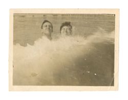 Two people swimming
