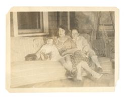 Jane, Margaret, and Jack Howard with a dog