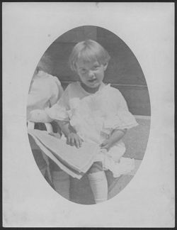 Joanne Carmichael sitting on front porch, summer 1918.