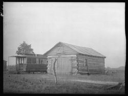 Log cabin and street car, near Milroy, road No. 244