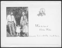 Christmas photo card of woman, man and child.