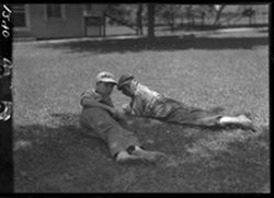 Billy Jones and George Turner on grass in front of studio