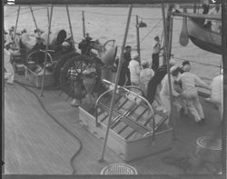 Sailors lowering lifeboat