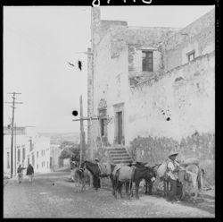 Burros being unloaded and church corner near Dickinson's