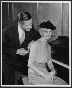 Hoagy with Lida Carmichael seated at a piano.