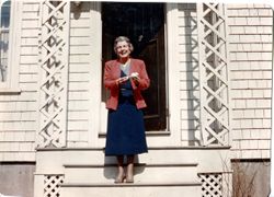 Marie Boisen Bradley on steps with flowers