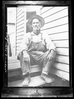 Men wearing overalls, unidentified