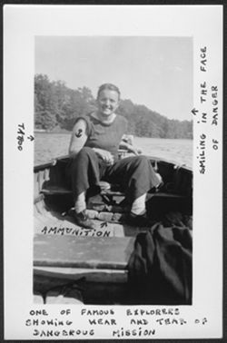 Unidentified female friend of Martha Carmichael's seated in a boat on Lake Wawasee.