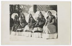 Item 01 . Row of 5 young women in "weepeel" headdresses seated in patio (?). See photo Item 13 for same women seated in different order.