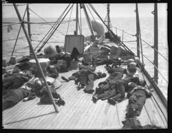 Sailors resting on deck