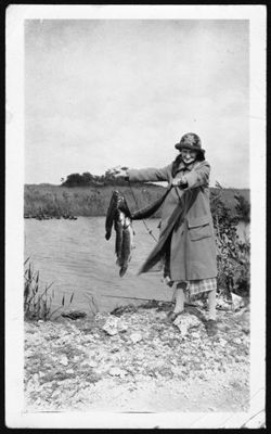 Lida Carmichael catching a fish on Tamiami Trail, Florida.