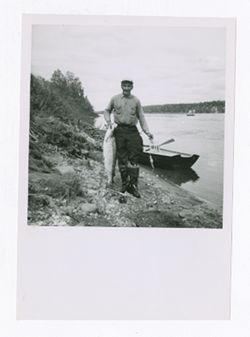Man posing with a caught fish