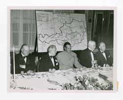 Roy Howard and other men at a meeting