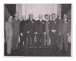 Roy W. Howard posing for a photograph with other business associates