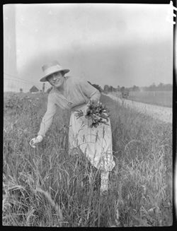 Pearl Fisher picking flowers