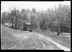 Philander Phillips place, on north fork of Muscatatuck river, six miles east of Vernon, Ind. Mill and bldgs from roadway near gate (art subject) Road to Mill
