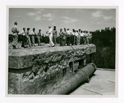 Men standing on a wall