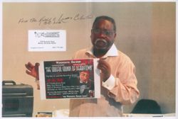 Photocopied picture of Lewis holding a poster from "The Soulful Sounds of Derbytown", 2016