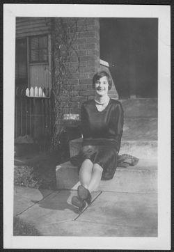 Martha Carmichael seated on front steps of house at 3037 Graceland Avenue, Indianapolis, Indiana.