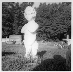 Figure of child praying, graveyard decoration