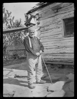 John Selmier in yard waiting for cider (see also: I.U. neg. 224, 8x10 727)