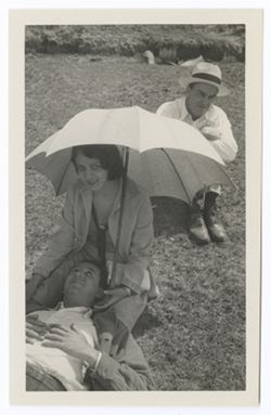 Item 0418. Unidentified man seated in the background.