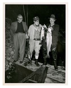 Roy Howard and other men posing with fish