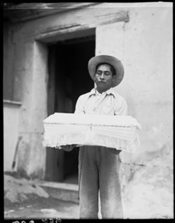 Man with coffin, Oaxaca, perp
