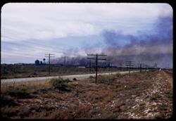 Smoke pall over Sid Richardson Carbon Co. plant 9 miles west od Odessa, Tex.
