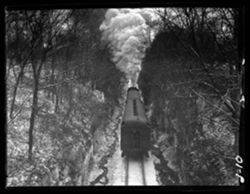 Pennsylvania train on cut at Madison, below bridge, winter