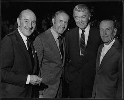 Hoagy Carmichael standing with (l-r) Lee Bowman, Henry Mancini, and Jimmy Stewart at a salute to Hoagy Carmichael, in Los Angeles, sponsored by the Indiana University Alumni Association.