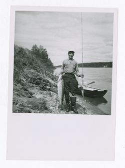 Man posing with caught fish