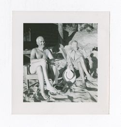 Two men relaxing on a beach