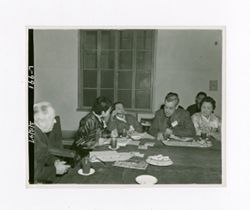 Roy Howard sits in a meeting