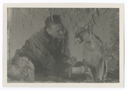 Item 0579. - 0582. Various shots of unidentified man with young mountain lion.