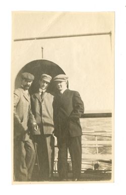 Three men standing together