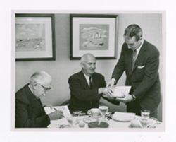 Roy Howard signing books with Frank Bartholomew