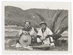 Item 0402.  Various shots of Eisenstein and man seen in Items 398 and 401 above clowning beside a maguey plant. They wear serapes and sombreros and in some shots have a large gourd. Seated in front of maguey.