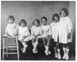 Six children in old fashion dress