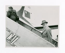 Roy and Peg Howard entering a plane