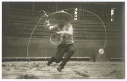 Item 71. Man leaping through loop of rope.