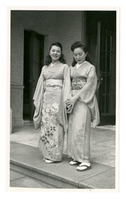Two women outside of a building