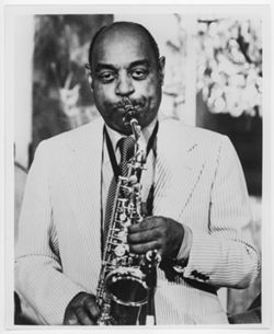 Bennett L. Carter with saxophone [archive photograph]