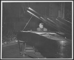 Hoagy Carmichael performing on stage.